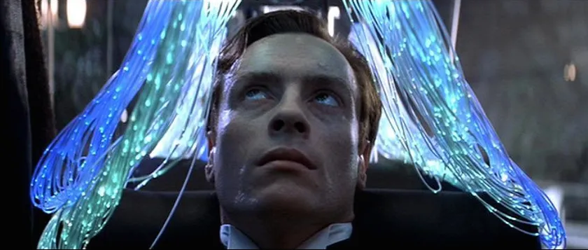 A villain undergoes a gene therapy procedure with glowing fibre optic tendrils draped over his head in Die Another Day