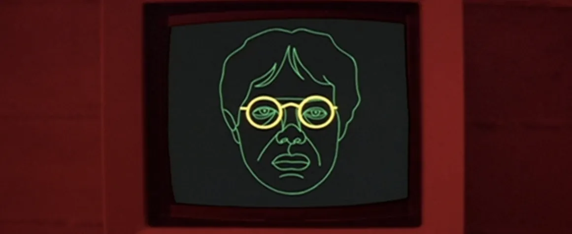 A crude green wireframe face with yellow glasses on a CRT monitor, passing for cutting-edge technology in For Your Eyes Only