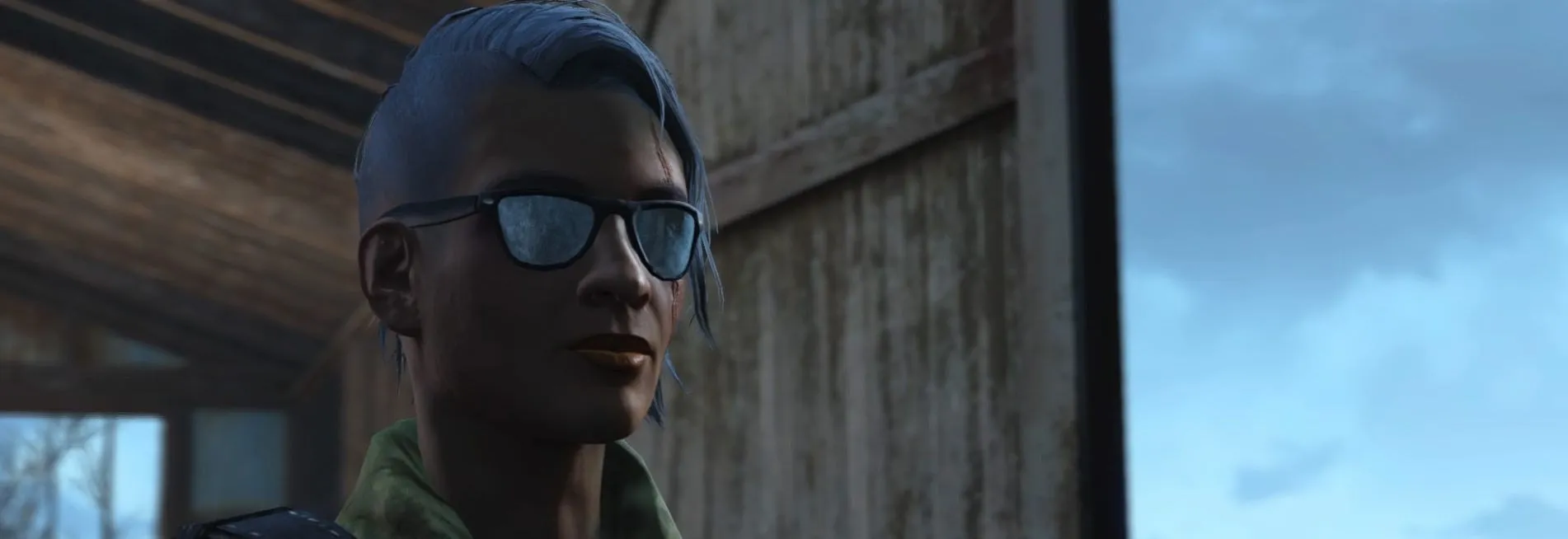 Close-up of a Fallout 4 character with blue hair and glasses against a post-apocalyptic backdrop